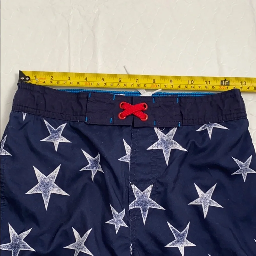 Cat and Jack American Flag red white blue swim trunks L = 12-14